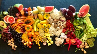sliced fruits on black plate