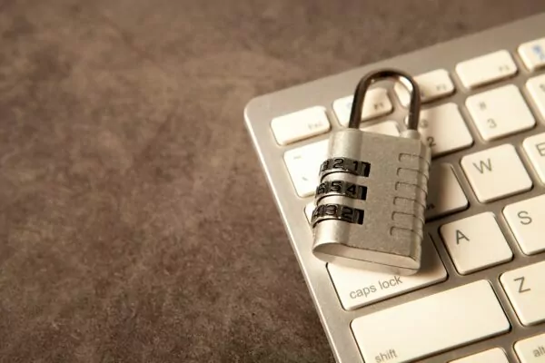 A padlock rests on a computer keyboard